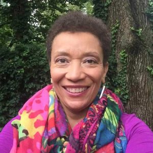 diane-portrait-square A photo of Diane Postell, a black woman with short dark hair, wearing bright clothing and smiling